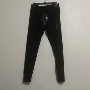 New with tags, women’s black leggings, 76% nylon 24% elastic, machine wash cold.